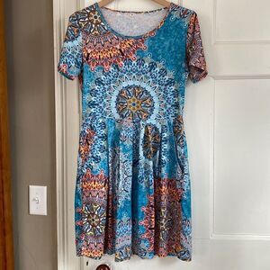 Cute print knit dress with pockets, size medium.